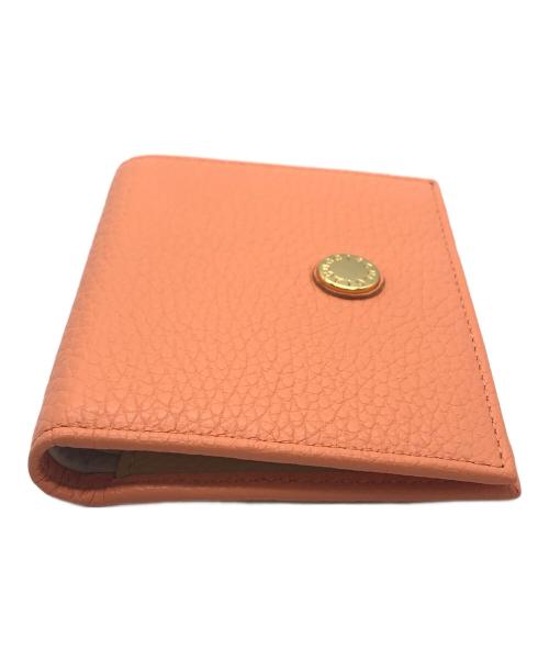 IACUCCI（イアクッチ）IACUCCI (イアクッチ) 2つ折り財布 オレンジの古着・服飾アイテム