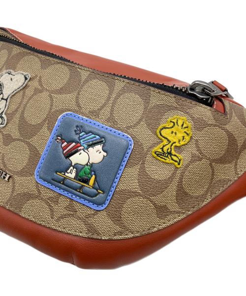 COACH（コーチ）COACH (コーチ) PEANUTS (ピーナッツ) ボディーバッグの古着・服飾アイテム