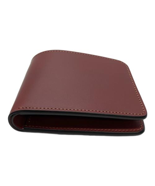 WILDSWANS（ワイルドスワンズ）WILDSWANS (ワイルドスワンズ) 2つ折り財布 レッドの古着・服飾アイテム