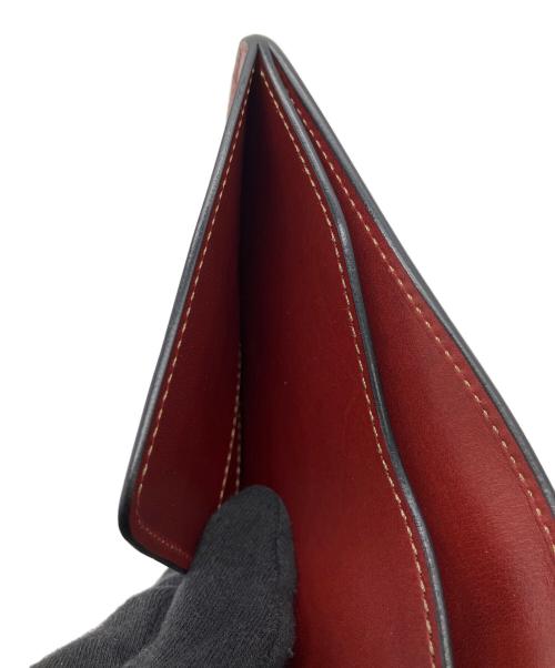 WILDSWANS（ワイルドスワンズ）WILDSWANS (ワイルドスワンズ) 2つ折り財布 レッドの古着・服飾アイテム