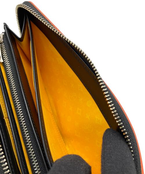 CASTELBAJAC（カステルバジャック）CASTELBAJAC (カステルバジャック) 長財布 オレンジの古着・服飾アイテム