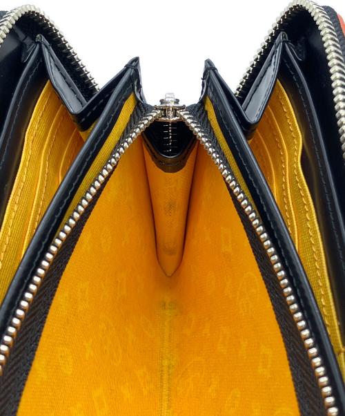 CASTELBAJAC（カステルバジャック）CASTELBAJAC (カステルバジャック) 長財布 オレンジの古着・服飾アイテム