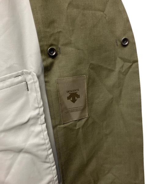 Plantation × DESCENTE（プランテーション×デザント）Plantation × DESCENTE (プランテーション×デザント) ノーカラーストレッチパッカブルコート サイズ:Mの古着・服飾アイテム