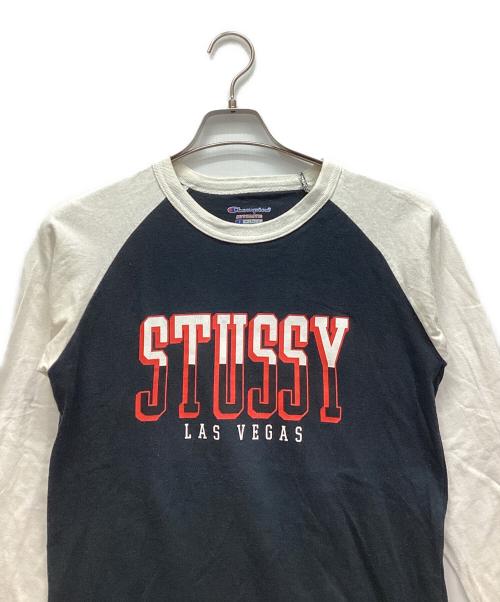 Champion（チャンピオン）Champion (チャンピオン) stussy (ステューシー) 長袖カットソー ブラック×ホワイト サイズ:Sの古着・服飾アイテム