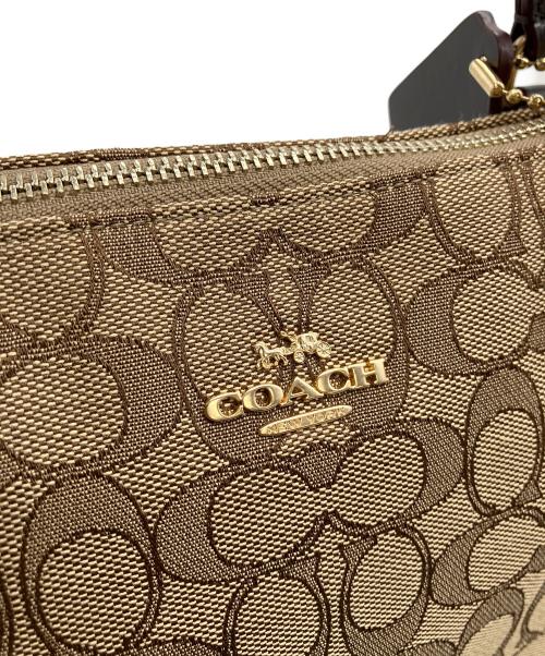 COACH（コーチ）COACH (コーチ) エンボスシグネチャー　ハンドバッグ ブラウンの古着・服飾アイテム