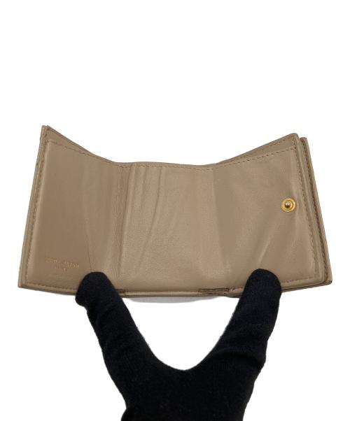 Yves Saint Laurent（イヴサンローラン）Yves Saint Laurent (イヴサンローラン) 3つ折り財布 ベージュの古着・服飾アイテム