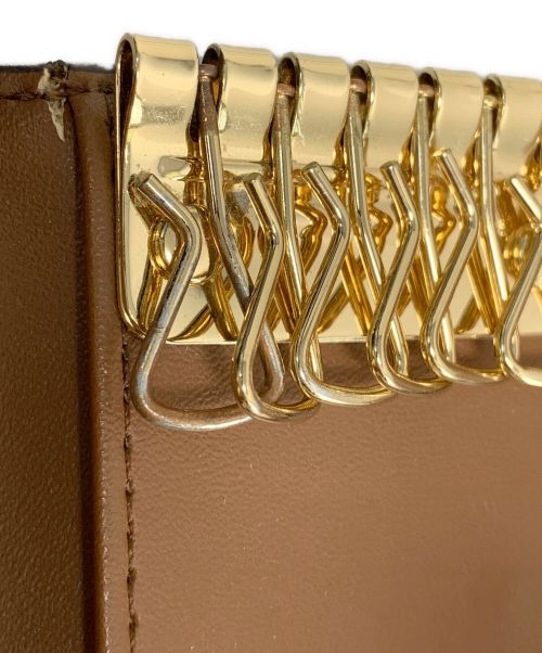 MICHAEL KORS（マイケル・コース）MICHAEL KORS (マイケルコース) MICHAEL KORS キーケース ブラウン×ホワイトの古着・服飾アイテム