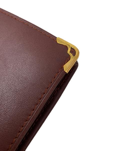 Cartier（カルティエ）Cartier (カルティエ) Cartier 2つ折り財布 ボルドーの古着・服飾アイテム