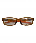 OAKLEYオークリー）の古着「サングラス」｜オレンジ