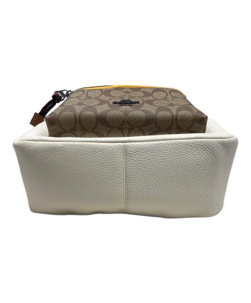 COACH（コーチ）COACH (コーチ) Disney (ディズニー) COACH Disney 日本限定ディズニーコラボ リュック ベージュ×アイボリーの古着・服飾アイテム