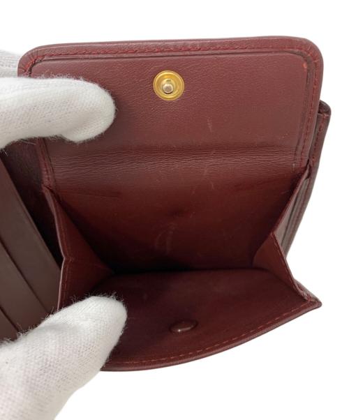 Cartier（カルティエ）Cartier (カルティエ) Cartier 2つ折り財布 ワインレッドの古着・服飾アイテム