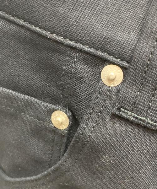 COMME des GARCONS JUNYA WATANABE MAN（コム デ ギャルソン ジュンヤ ワタナベ マン）COMME des GARCONS JUNYA WATANABE MAN (コムデギャルソンジュンヤワタナベマン) LEVI'S (リーバイス) コットンスラックスパンツ ブラック サイズ:Mの古着・服飾アイテム