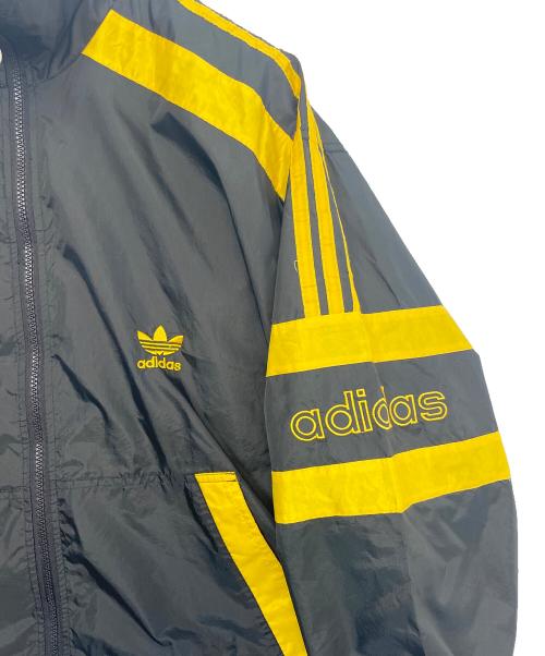 adidas（アディダス）adidas (アディダス) ナイロンジャケット ブラック×イエロー サイズ:Mの古着・服飾アイテム