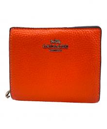 COACH（コーチ）の古着「2つ折り財布」｜オレンジ
