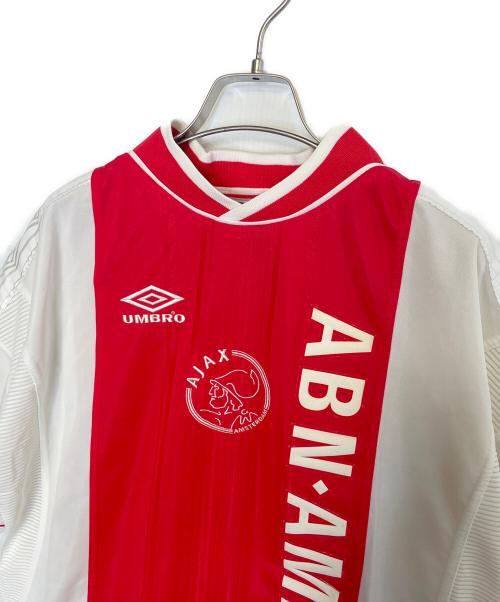UMBRO（アンブロ）UMBRO (アンブロ) UMBRO サッカーユニフォーム ゲームシャツ 1999/2000 アヤックス クライフ記念パッチ ヨハンクライフ レッド×ホワイト サイズ:Mの古着・服飾アイテム