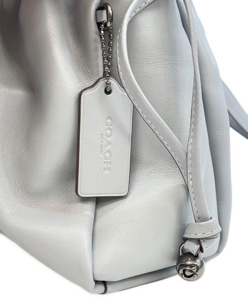 COACH（コーチ）COACH (コーチ) フェイ ドローストリング バッグ スカイブルーの古着・服飾アイテム