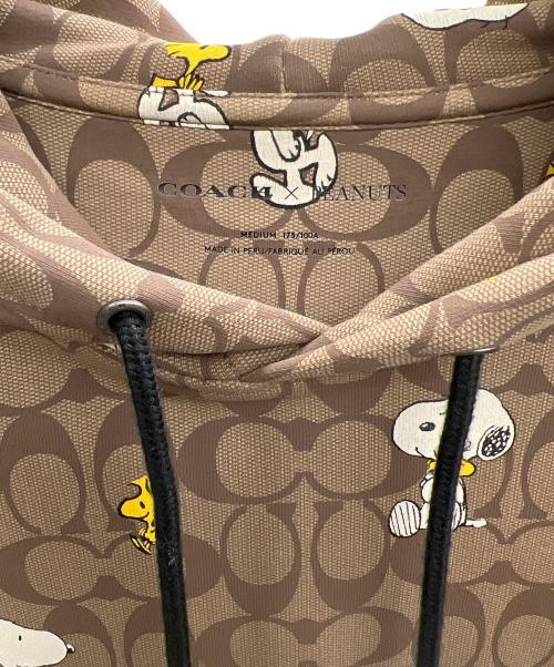 COACH（コーチ）COACH (コーチ) SNOOPY (スヌーピー) プルオーバーパーカー ブラウン サイズ:Mの古着・服飾アイテム