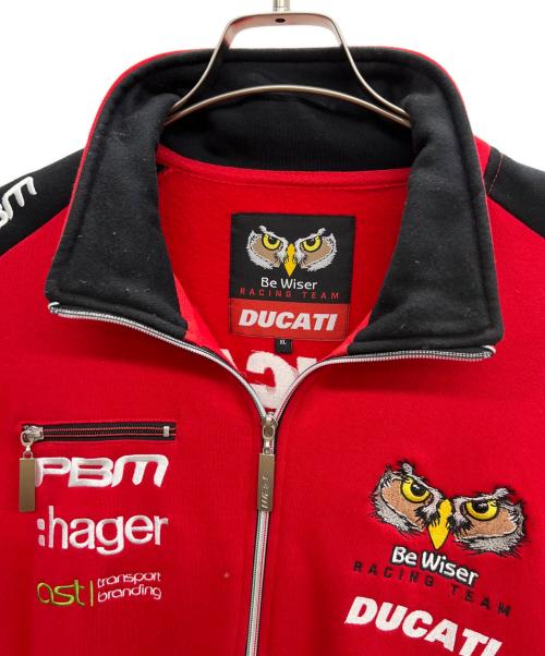 Be Wiser Racing Team（ビー・ワイザー・レーシング・チーム）Be Wiser Racing Team (ビー・ワイザー・レーシング・チーム) DUCATI (ドゥカティ) トラックジャケット レッド サイズ:XLの古着・服飾アイテム