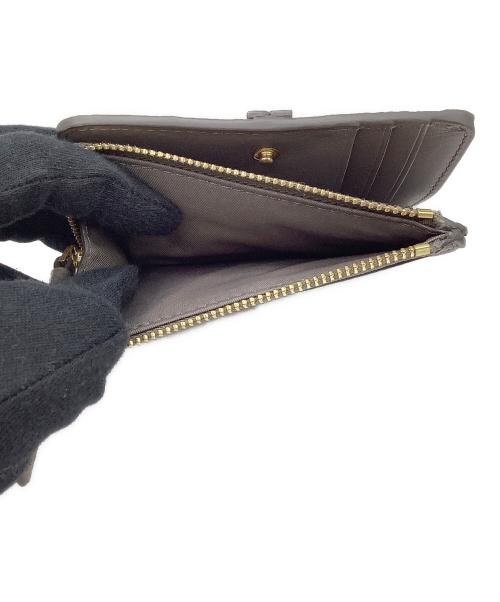 TORY BURCH（トリーバーチ）TORY BURCH (トリーバーチ) 2つ折り財布　TORY BURCH ブラウンの古着・服飾アイテム