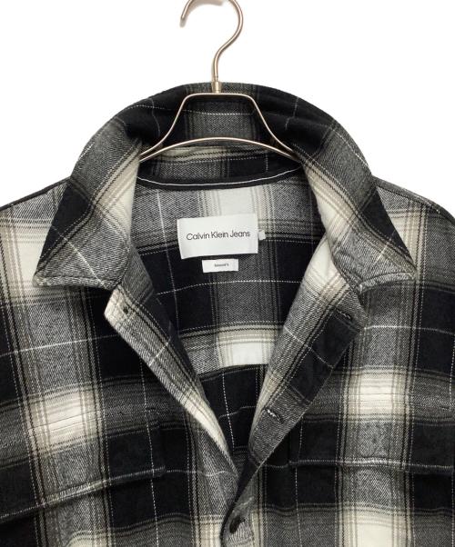 Calvin Klein Jeans（カルバンクラインジーンズ）Calvin Klein Jeans (カルバンクラインジーンズ) ジャケット ブラック×グレー サイズ:Mの古着・服飾アイテム