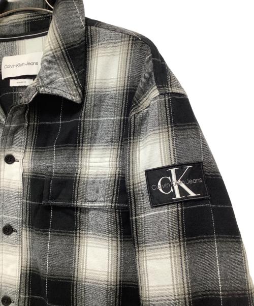 Calvin Klein Jeans（カルバンクラインジーンズ）Calvin Klein Jeans (カルバンクラインジーンズ) ジャケット ブラック×グレー サイズ:Mの古着・服飾アイテム