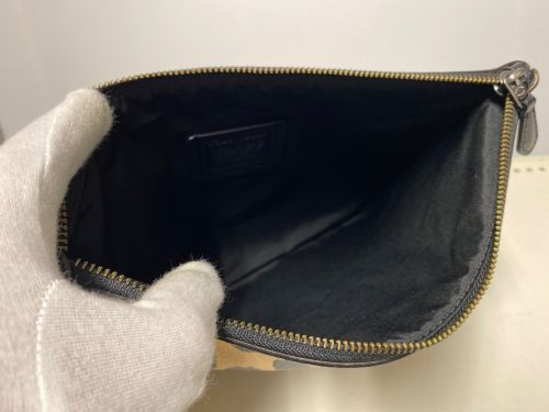 COACH（コーチ）COACH (コーチ) DISNEY (ディズニー) ラージリストレット30レオパードクラッチバッグの古着・服飾アイテム