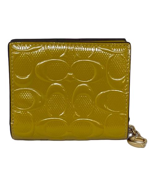 COACH（コーチ）COACH (コーチ) 2つ折り財布 マスタードの古着・服飾アイテム