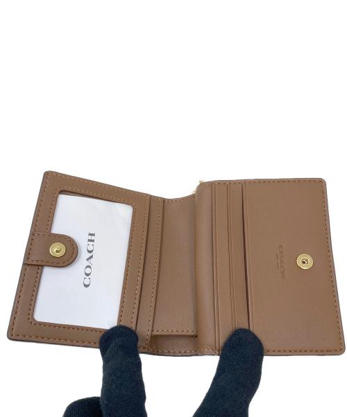 COACH（コーチ）COACH (コーチ) 2つ折り財布 マスタードの古着・服飾アイテム