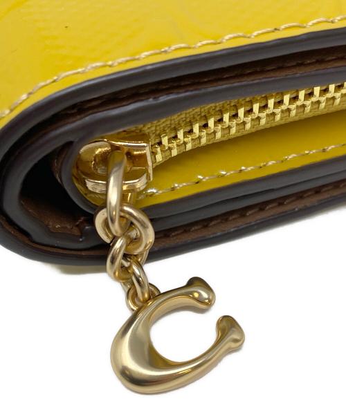 COACH（コーチ）COACH (コーチ) 2つ折り財布 マスタードの古着・服飾アイテム