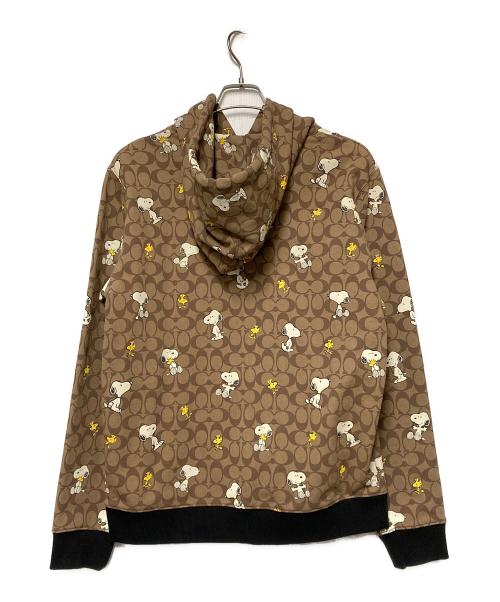 COACH（コーチ）COACH (コーチ) PEANUTS (ピーナッツ) シグネチャースヌーピーフーディー / プルオーバーパーカー ブラウン サイズ:Mの古着・服飾アイテム