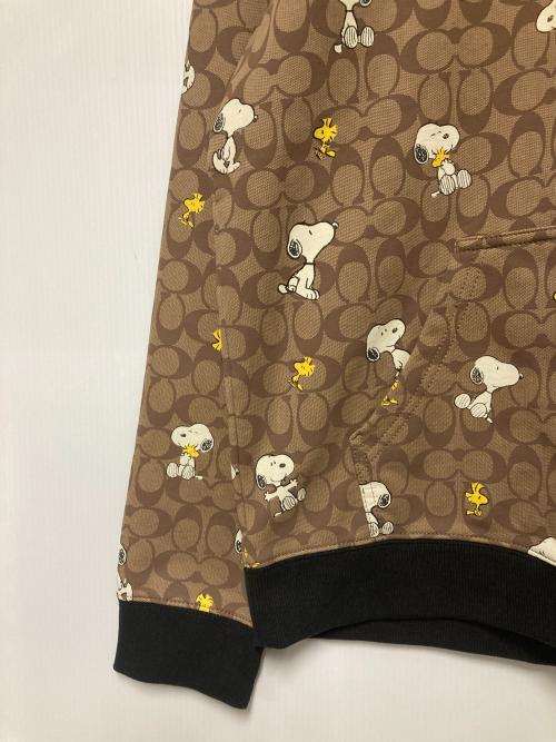 COACH（コーチ）COACH (コーチ) PEANUTS (ピーナッツ) シグネチャースヌーピーフーディー / プルオーバーパーカー ベージュ サイズ:Lの古着・服飾アイテム