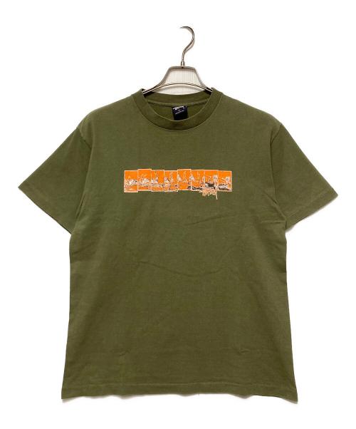 stussy（ステューシー）stussy (ステューシー) プリントTシャツ / 紺タグ オリーブ サイズ:Mの古着・服飾アイテム