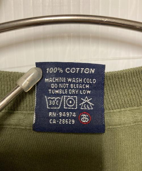 stussy（ステューシー）stussy (ステューシー) プリントTシャツ / 紺タグ オリーブ サイズ:Mの古着・服飾アイテム