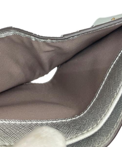 TORY BURCH（トリーバーチ）TORY BURCH (トリーバーチ) ミニ財布 シルバー色の古着・服飾アイテム