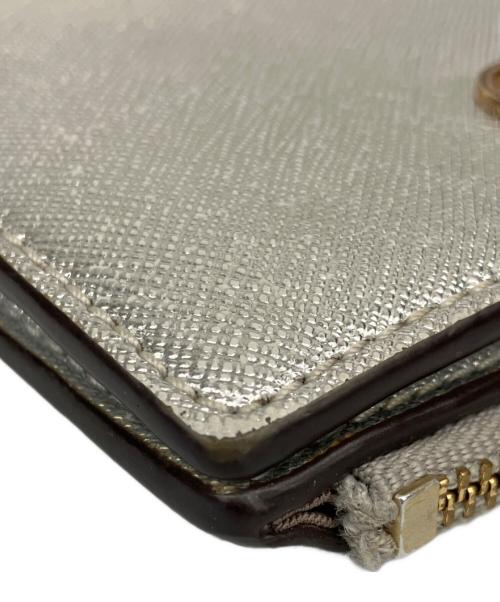 TORY BURCH（トリーバーチ）TORY BURCH (トリーバーチ) ミニ財布 シルバー色の古着・服飾アイテム