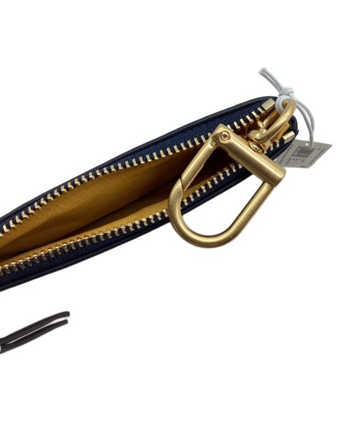 TORY BURCH（トリーバーチ）TORY BURCH (トリーバーチ) フラグメントケース グレーの古着・服飾アイテム