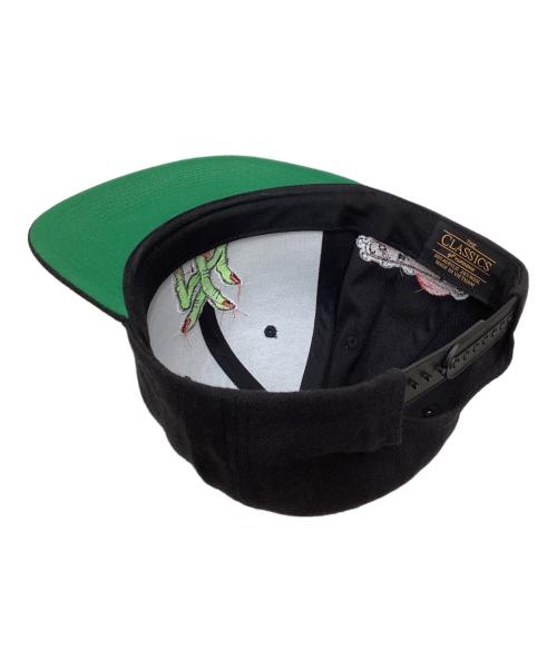 くっきー ぶてぃっく紫歯茎（クッキーブティックムラサキハグキ）くっきー ぶてぃっく紫歯茎 (クッキーブティックムラサキハグキ) キャップ ブラックの古着・服飾アイテム