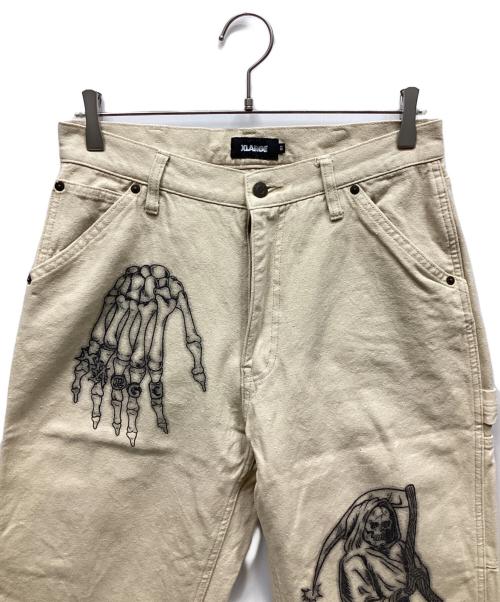 X-LARGE（エクストララージ）X-LARGE (エクストララージ) グラフィックペインターパンツ ベージュ サイズ:32の古着・服飾アイテム