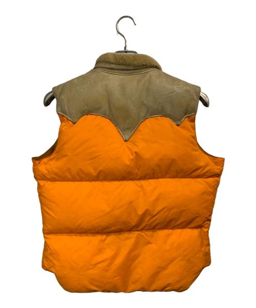 Rocky Mountain FeatherBed（ロッキーマウンテンフェザーベッド）Rocky Mountain FeatherBed (ロッキーマウンテンフェザーベッド) ダウンベスト ベージュ×オレンジ サイズ:11/12の古着・服飾アイテム