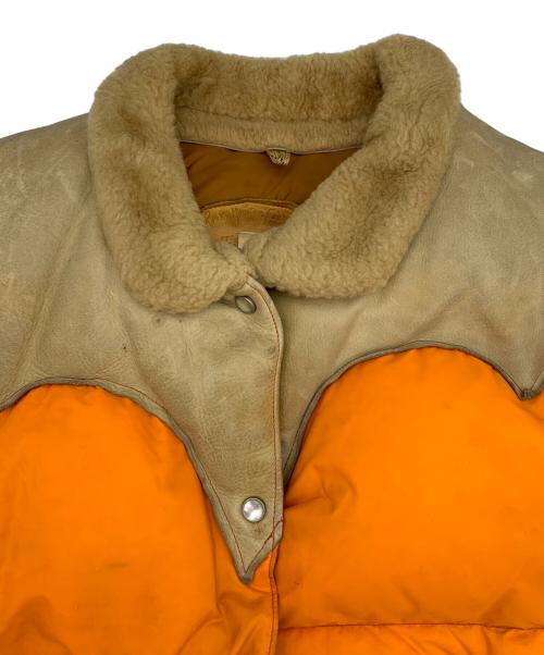Rocky Mountain FeatherBed（ロッキーマウンテンフェザーベッド）Rocky Mountain FeatherBed (ロッキーマウンテンフェザーベッド) ダウンベスト ベージュ×オレンジ サイズ:11/12の古着・服飾アイテム