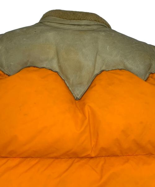 Rocky Mountain FeatherBed（ロッキーマウンテンフェザーベッド）Rocky Mountain FeatherBed (ロッキーマウンテンフェザーベッド) ダウンベスト ベージュ×オレンジ サイズ:11/12の古着・服飾アイテム