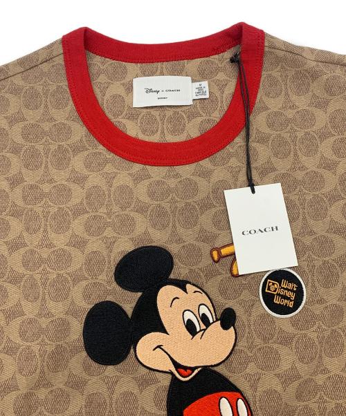 COACH（コーチ）COACH (コーチ) DISNEY (ディズニー) ミッキーマウス シグネチャー Tシャツ ベージュ サイズ:Ｍの古着・服飾アイテム