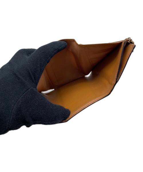 MCM（エムシーエム）MCM (エムシーエム) 3つ折り財布 ブラウン×ブラックの古着・服飾アイテム