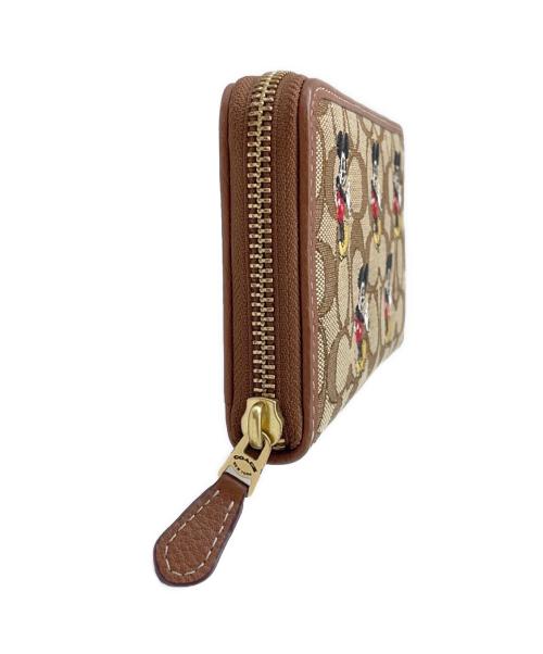 COACH（コーチ）COACH (コーチ) DISNEY (ディズニー) COACH×Disney　ラウンドファスナー財布 ブラウンの古着・服飾アイテム