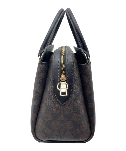 COACH（コーチ）COACH (コーチ) ダーシー キャリーオール・シグネチャー2WAYバッグ ブラウンの古着・服飾アイテム