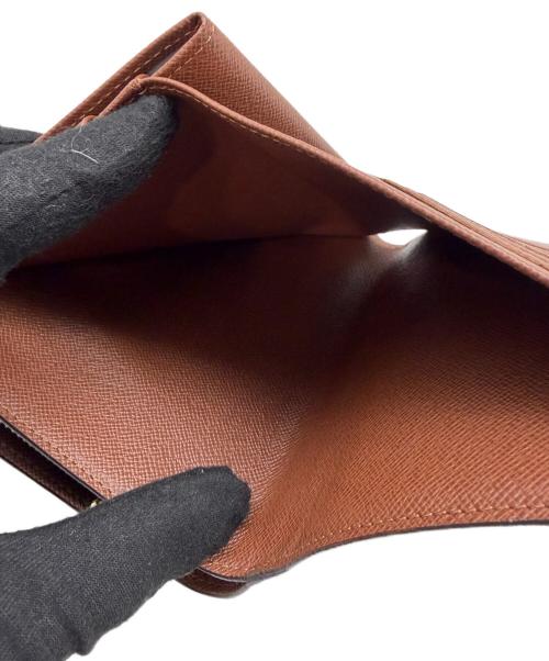 LOUIS VUITTON（ルイ ヴィトン）LOUIS VUITTON (ルイ ヴィトン) 2つ折り財布 モノグラム ポルトパピエ・ジップ ブラウンの古着・服飾アイテム