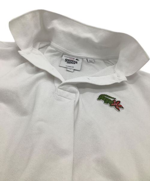 LACOSTE（ラコステ）LACOSTE (ラコステ) ポロシャツ　STRANGER THINGS　NETFLIXコラボ ホワイト サイズ:3の古着・服飾アイテム