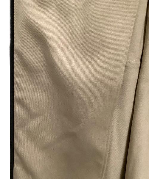 UNITED TOKYO（ユナイテッドトーキョー）UNITED TOKYO (ユナイテッドトーキョー) オブリークカッティングケープコート ベージュの古着・服飾アイテム