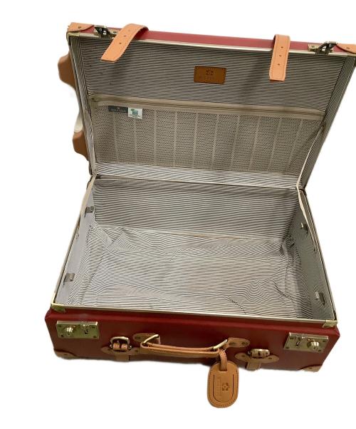 world trunk（ワールドトランク）world trunk (ワールドトランク) キャリーバッグ レッド×ブラウンの古着・服飾アイテム