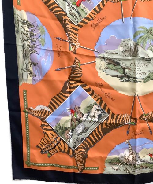 HERMES（エルメス）HERMES (エルメス) 大判スカーフ カレ90/La Chasse en Afrique オレンジ×ブラックの古着・服飾アイテム
